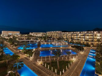 The hotel grounds lit up at night